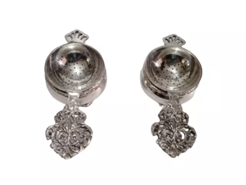 Pair of Flower design Victorian Style silver plated tea strainers